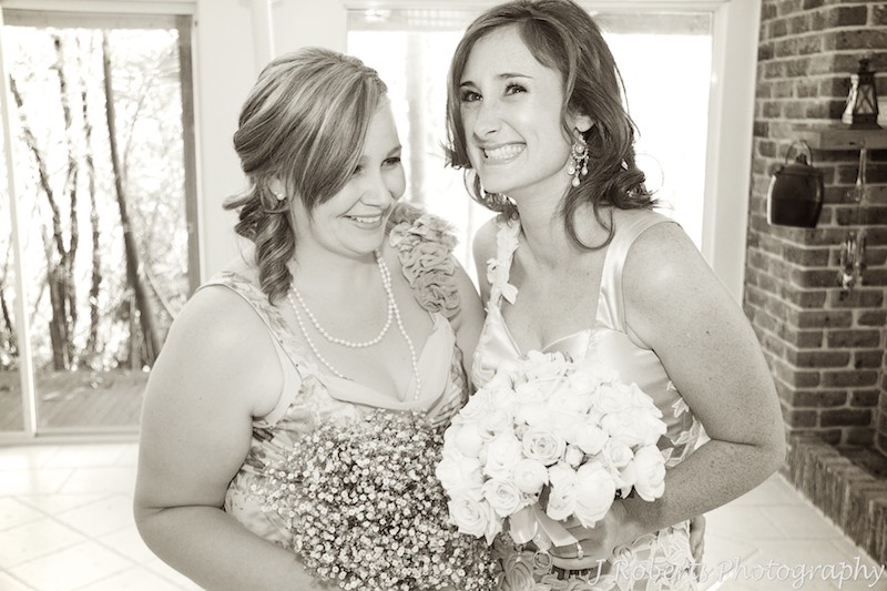 Bride laughing with her bridesmaid = wedding photography sydney